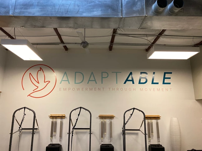 Large dye cut wall graphic for Adapt and Able.