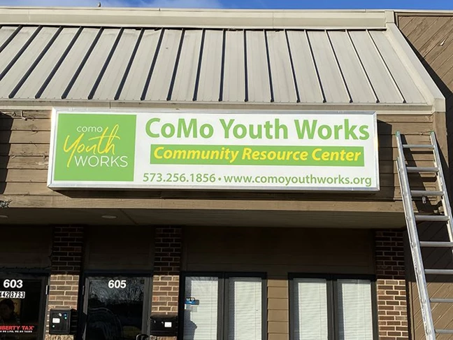 This store front sign was made for Como Youth Works.