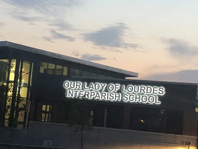 These back lit dimensional letters were made for Our Lady of Lourdes Interparish School.