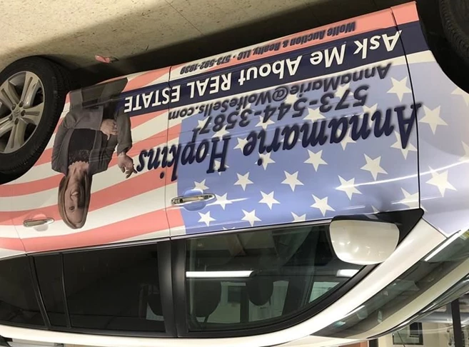 This patriotic car wrap was made for Annamarie Hopkins real estate. 
